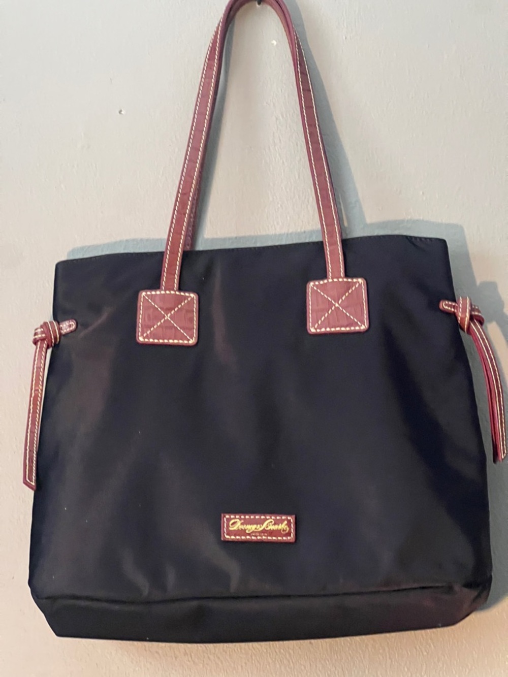 Dooney & Bourke Black Tote with Brown Trim and Handles